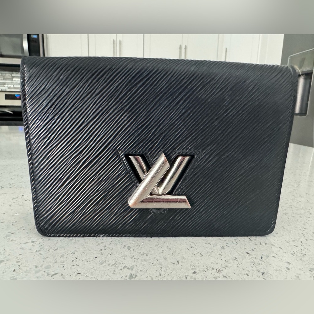 Authentic Used Louis Vuitton cross body. Chain detached. Still has life left!!